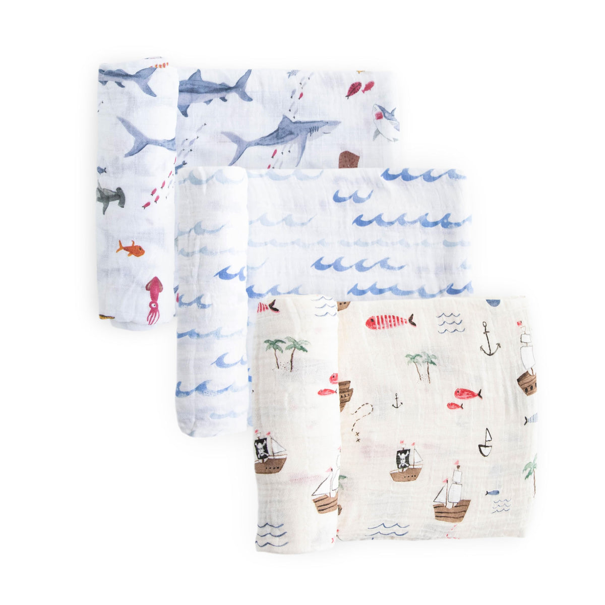 Little Unicorn premium muslin swaddle Shark-2 design offers cozy swaddling and playful style.