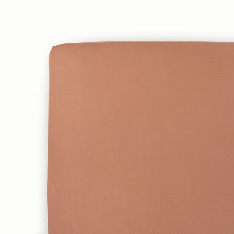Little Unicorn premium stretch knit crib sheet in terracotta showing plush softness for baby sleep