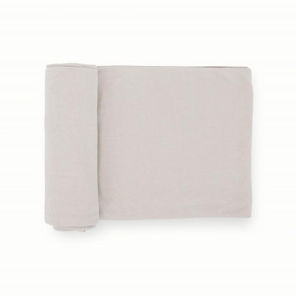 Little Unicorn premium stretch-knit swaddle blanket Pebble closeup highlights soft weave and gentle stretch for cozy swaddling.