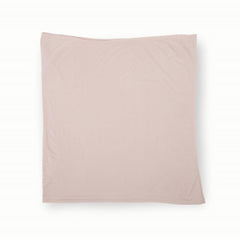 Little Unicorn baby-holding image shows soft-blush swaddle in calm morning moments