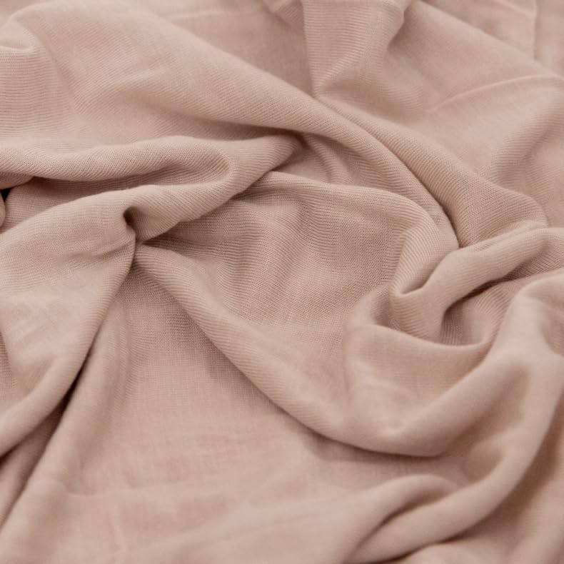 Little Unicorn swaddle wrapping demo highlights gentle stretch for secure, comfortable swaddling