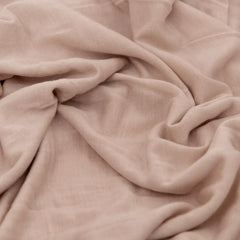 Little Unicorn swaddle wrapping demo highlights gentle stretch for secure, comfortable swaddling