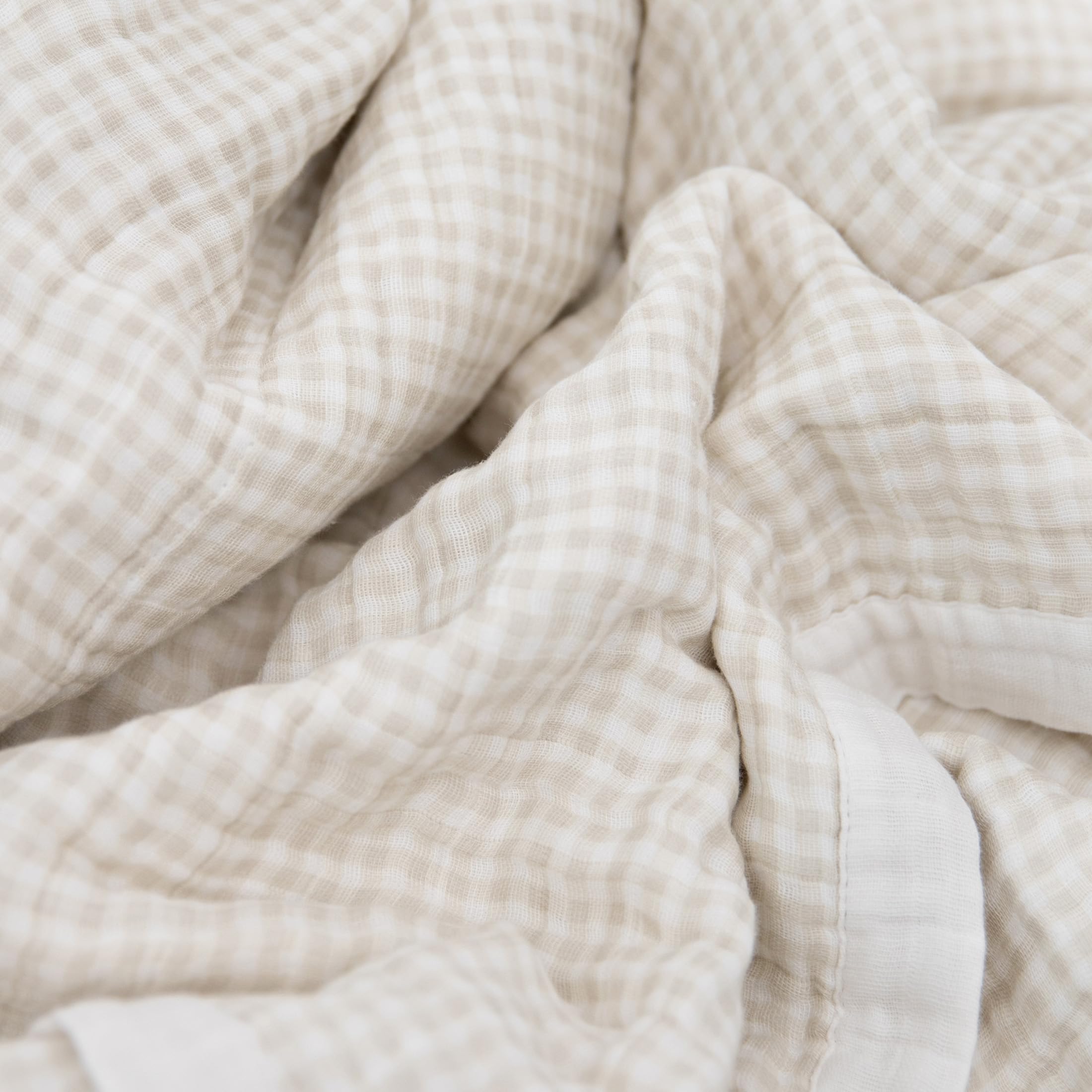 Little Unicorn quilt stitching detail highlights premium craftsmanship and breathable muslin