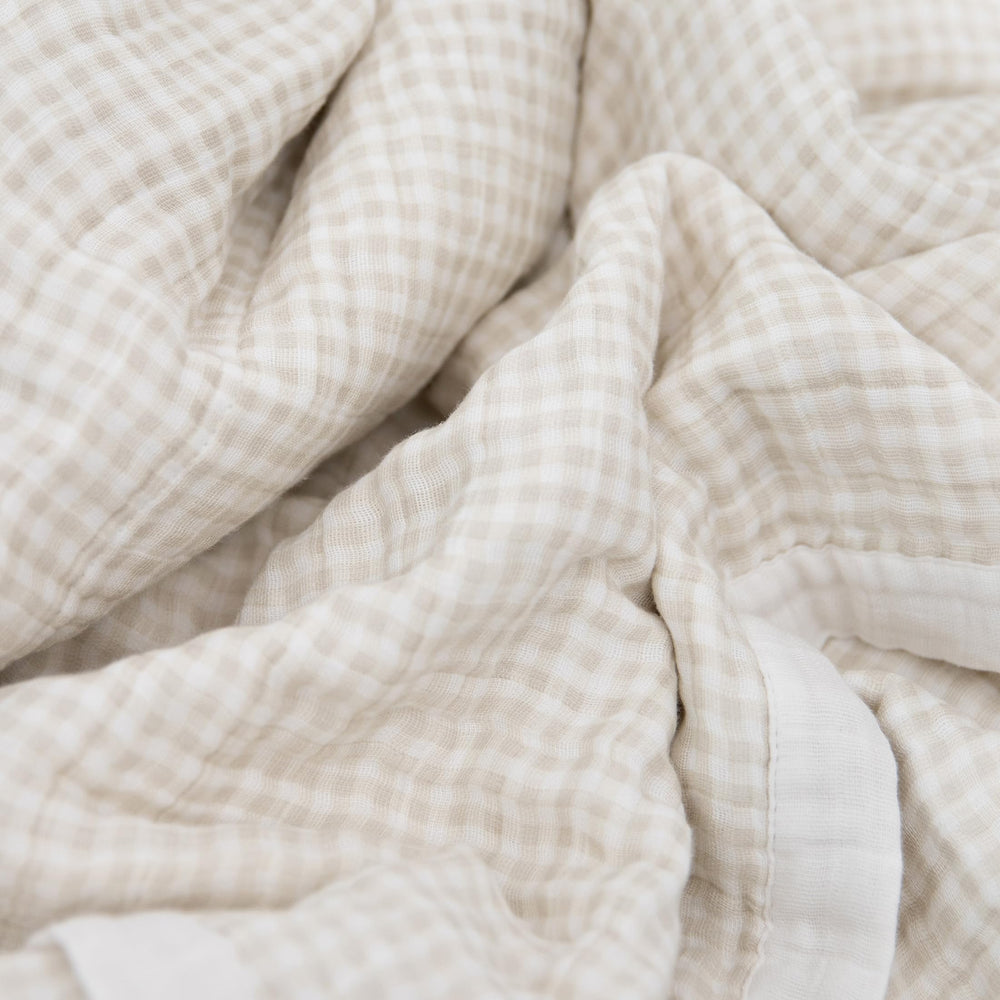 Little Unicorn quilt stitching detail highlights premium craftsmanship and breathable muslin