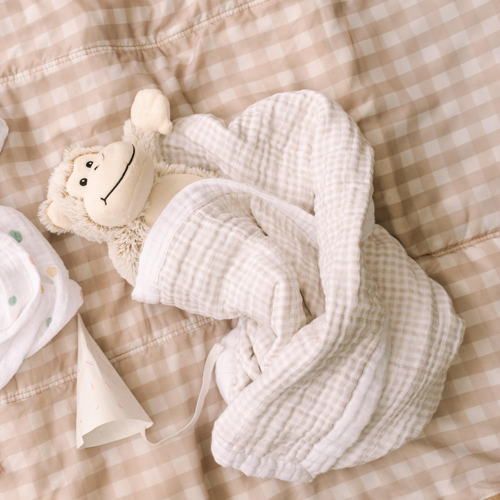Little Unicorn quilt tan gingham reverse fabric adds stylish, reversible comfort