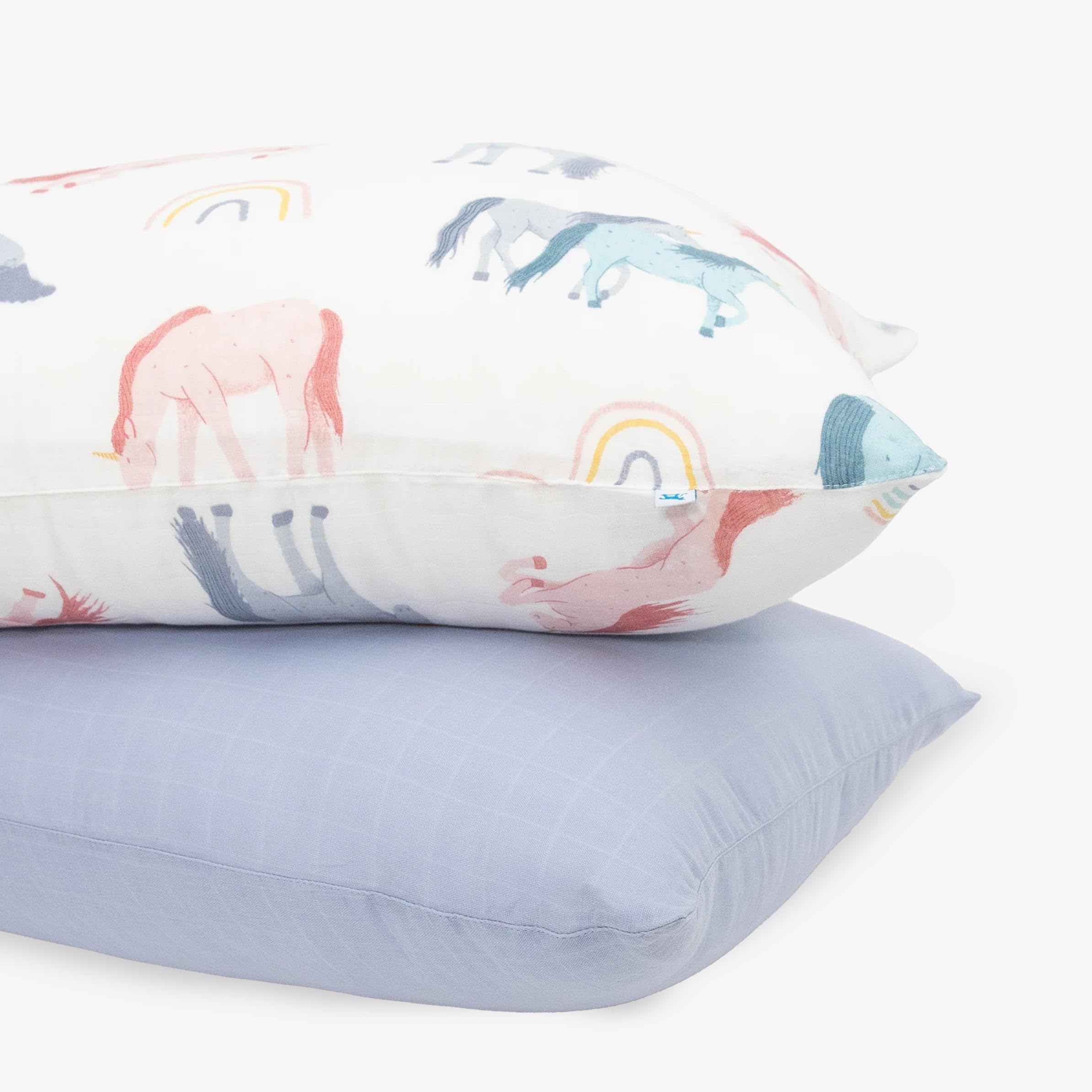 Little Unicorn standard pillowcase 2-pack shows unicorn pattern for cozy kids' sleep.