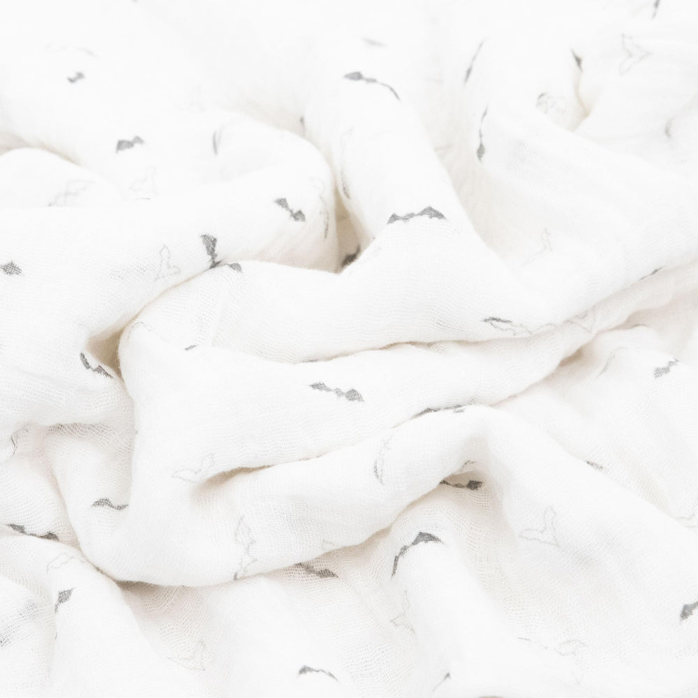 Little Unicorn swaddle blanket soft muslin texture highlights cozy mornings and gentle nursing sessions.