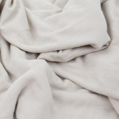 Little Unicorn swaddle blanket grey cross ready for stroller outings.