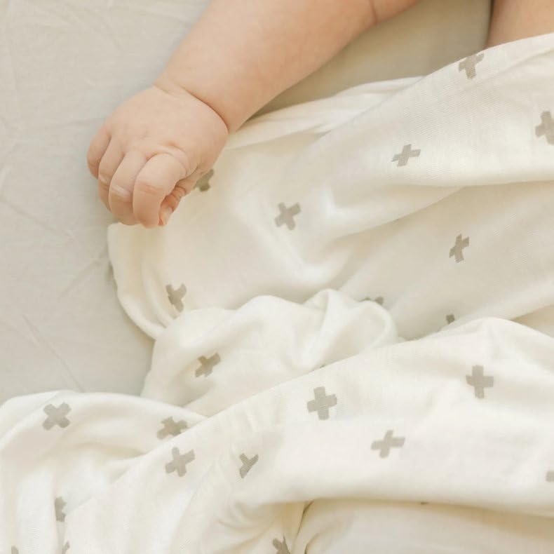 Little Unicorn swaddle blanket grey cross gift-ready package.