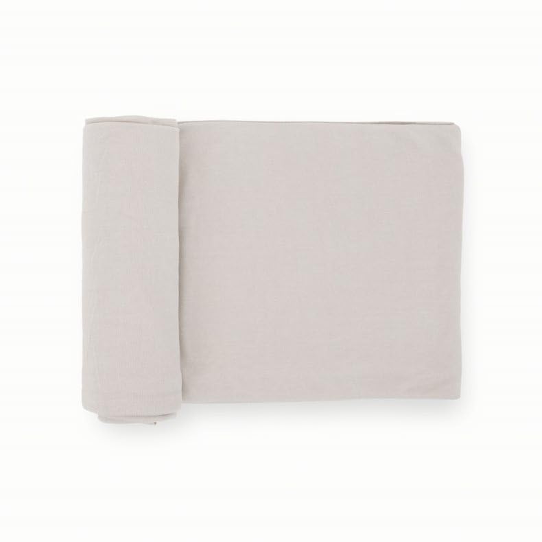 Little Unicorn swaddle blanket Pebble soft weave in-use demonstrates secure, comfortable cuddles.