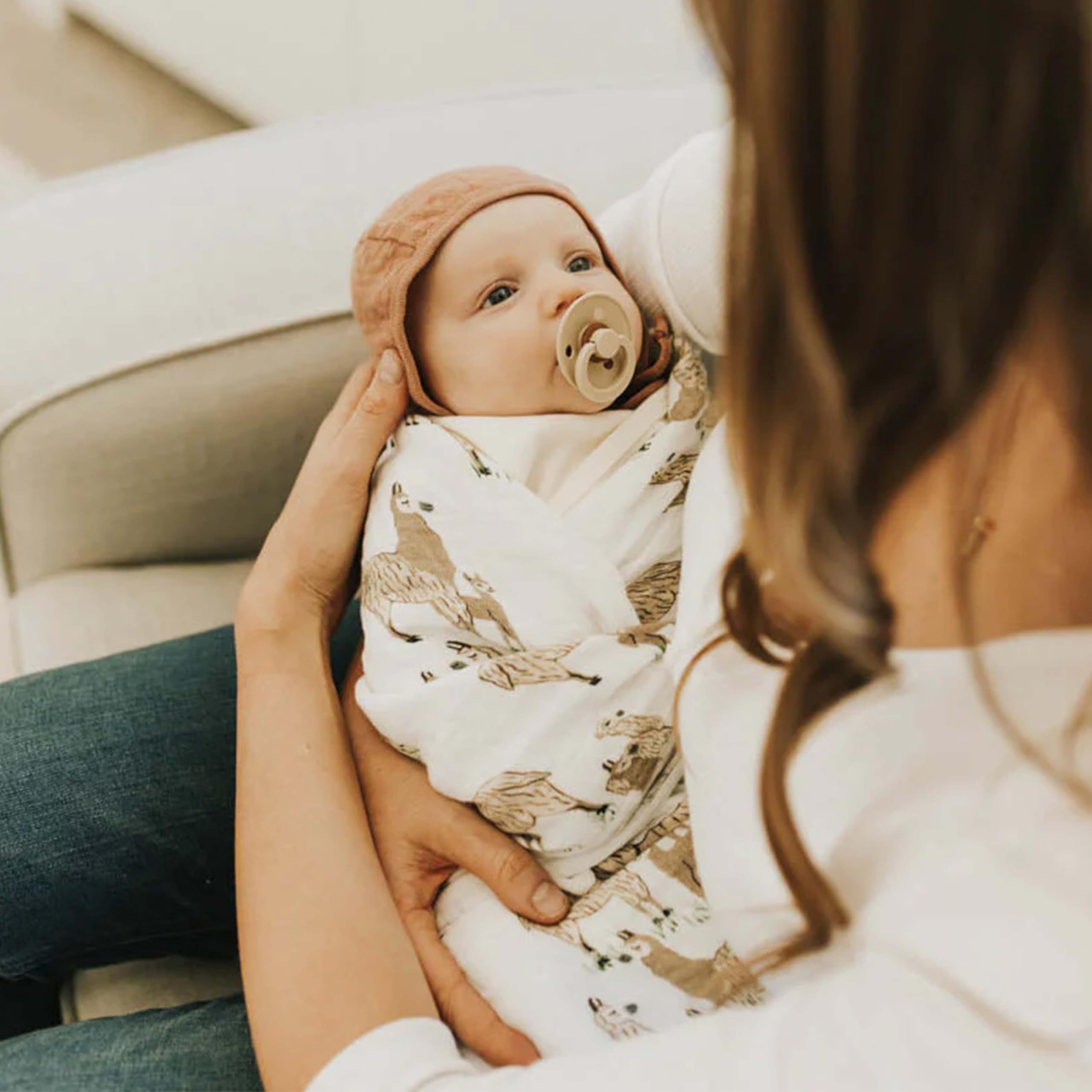 Little Unicorn swaddle car-seat wrap for cozy outings.