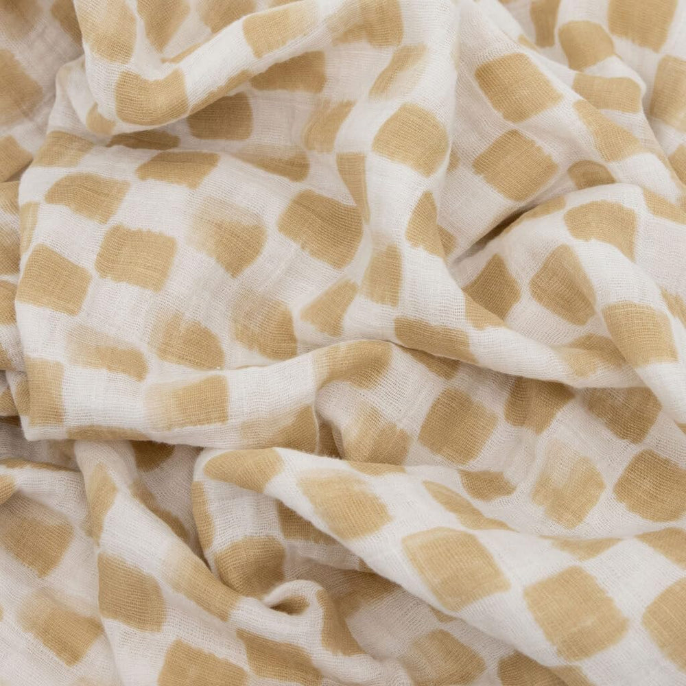 Little Unicorn swaddle cotton muslin fabric highlights breathable material for warm nights.
