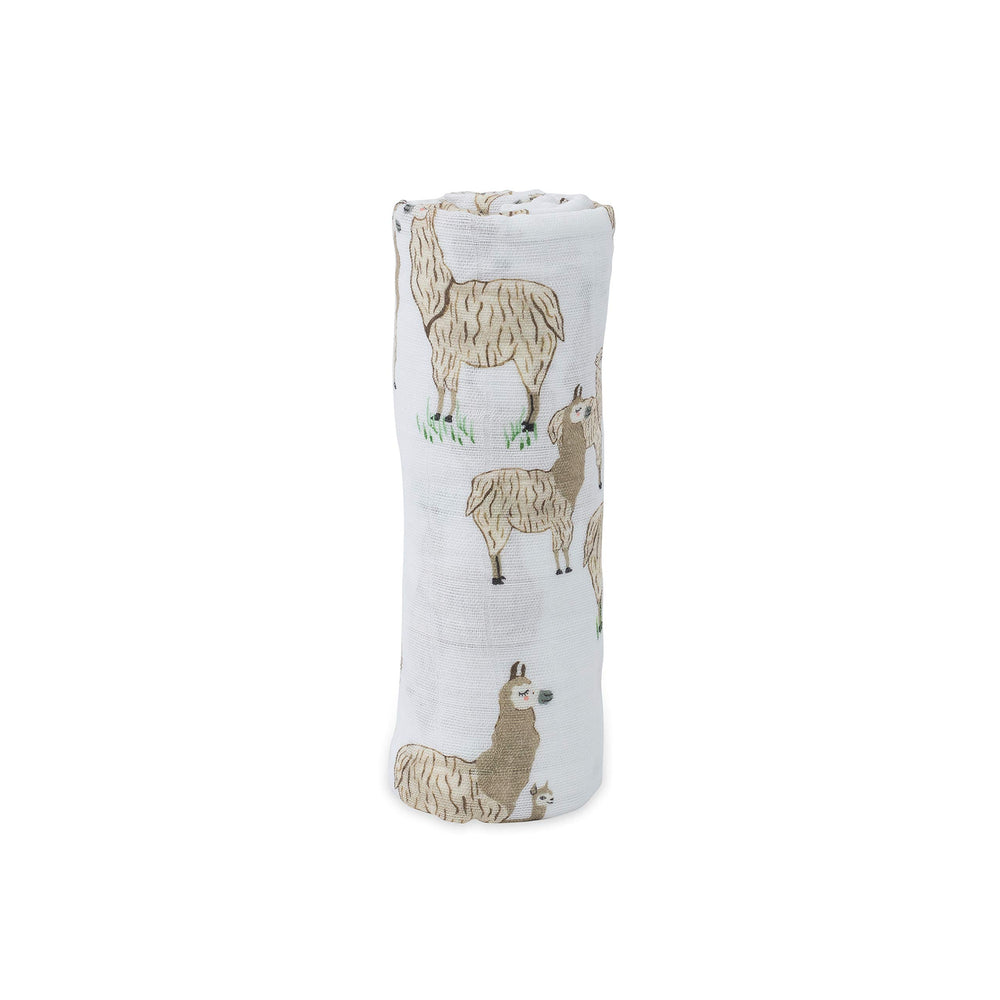 Little Unicorn swaddle folded display compact travel-friendly blanket for on-the-go.