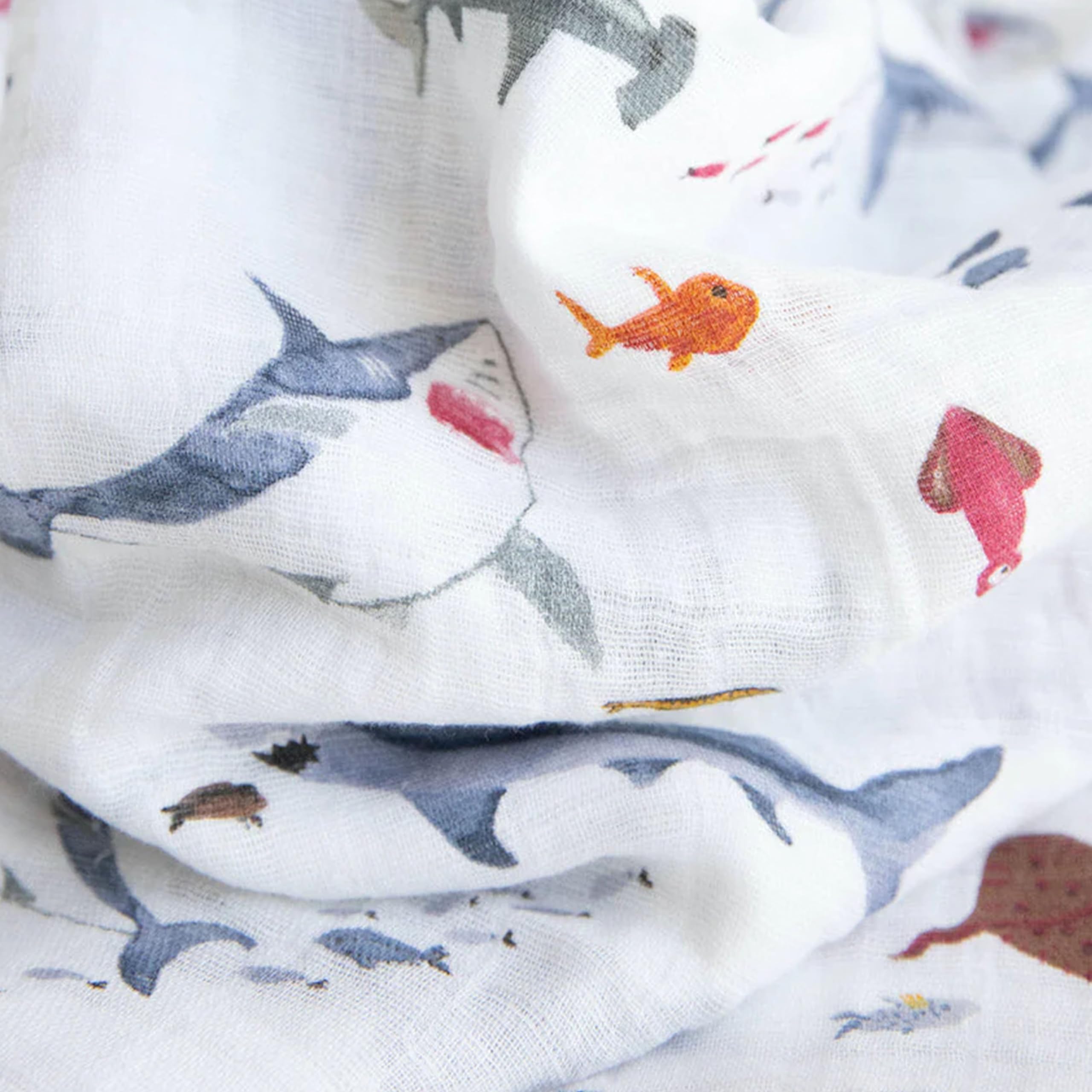 Little Unicorn swaddle demonstrating indoor-outdoor versatility as stroller cover or car seat wrap.