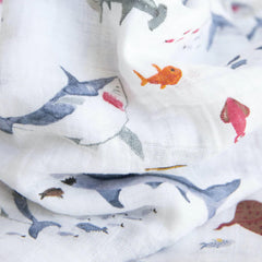 Little Unicorn swaddle demonstrating indoor-outdoor versatility as stroller cover or car seat wrap.