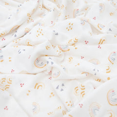 Little Unicorn swaddle rainbows laid out for nursing and peaceful daytime cuddles.