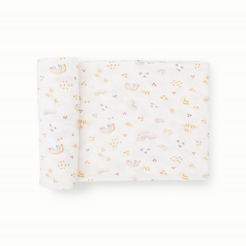 Little Unicorn swaddle rainbows fabric displays soft weave for breathable comfort.