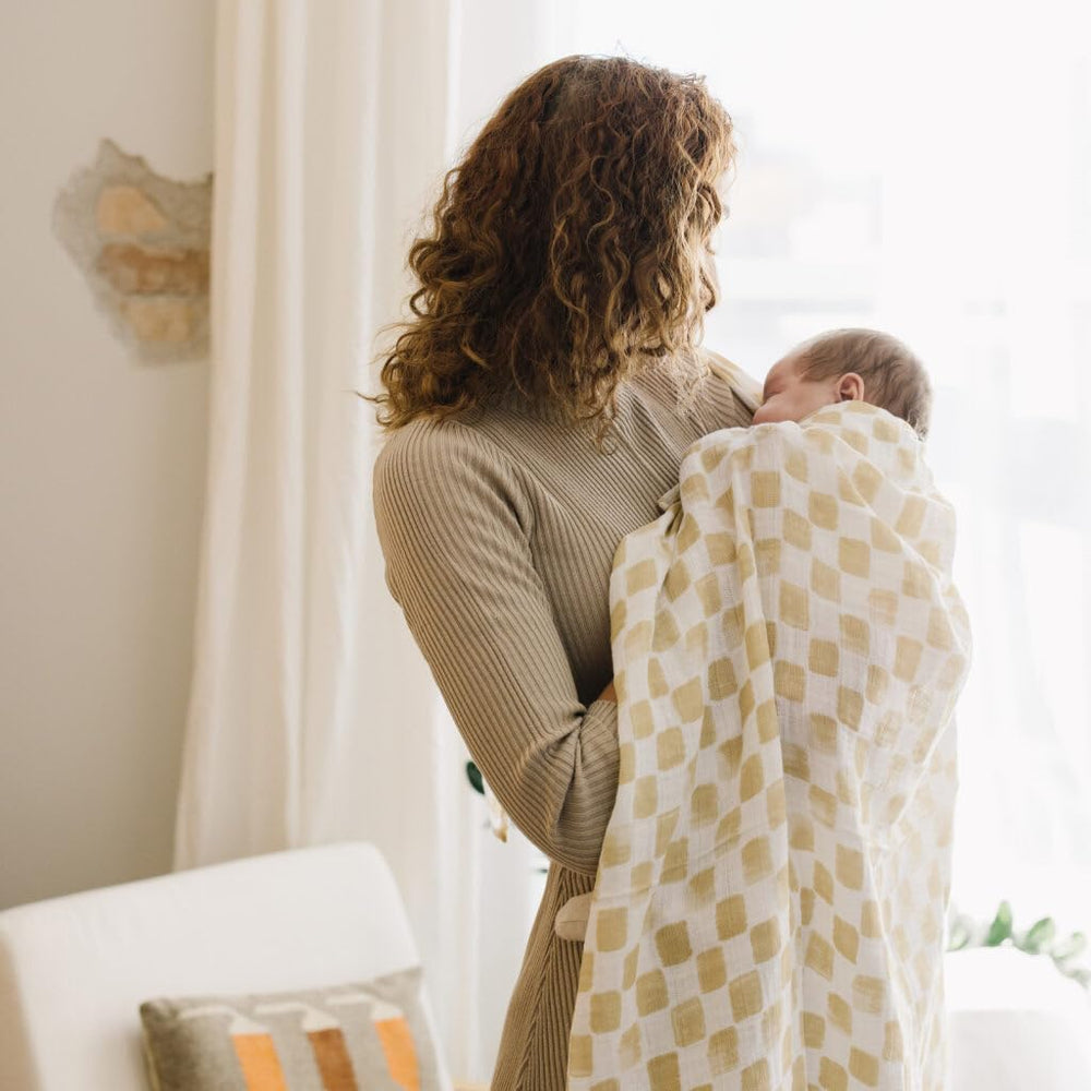 Little Unicorn swaddle travel compact design shows easy packing for outings.