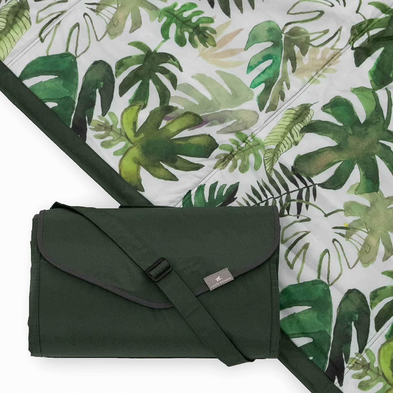 Little Unicorn tropical leaf blanket folded for travel