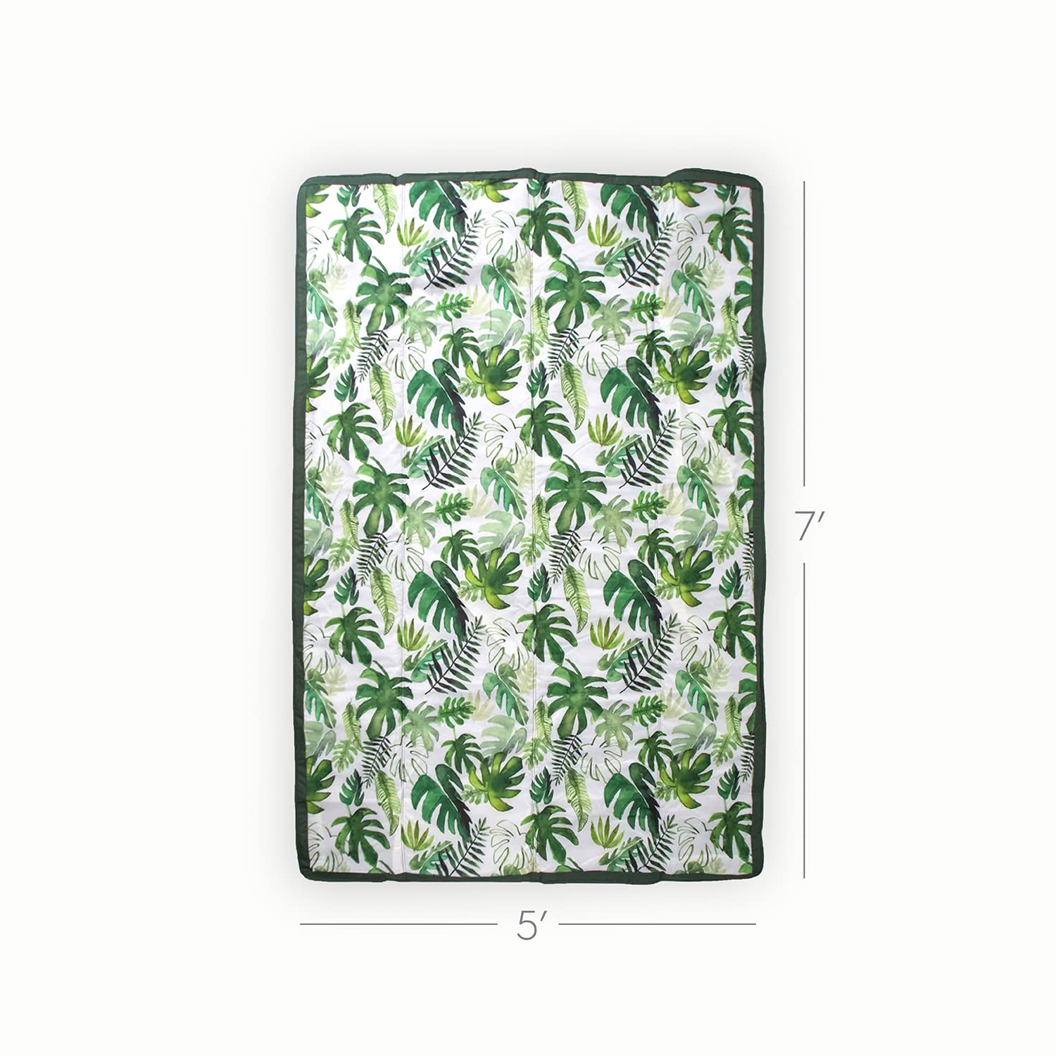 Little Unicorn tropical leaf blanket over the shoulder for hands-free picnics