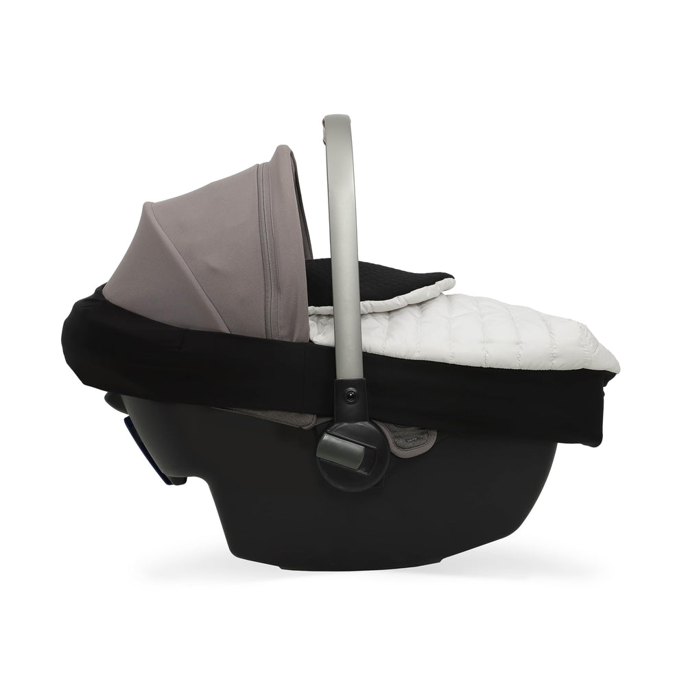 Little Unicorn Winter Car Seat Cover installed on a car seat shows stretch band in action.