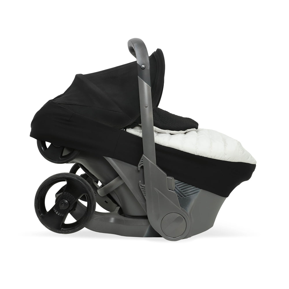 Little Unicorn Winter Car Seat Cover insulated fabric highlights warmth and wind protection for cold commutes.