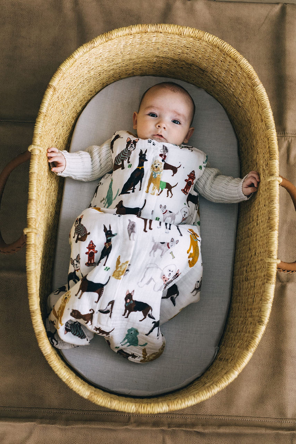 Little Unicorn Woof sleep sack with 2-way zipper enables easy diaper changes.