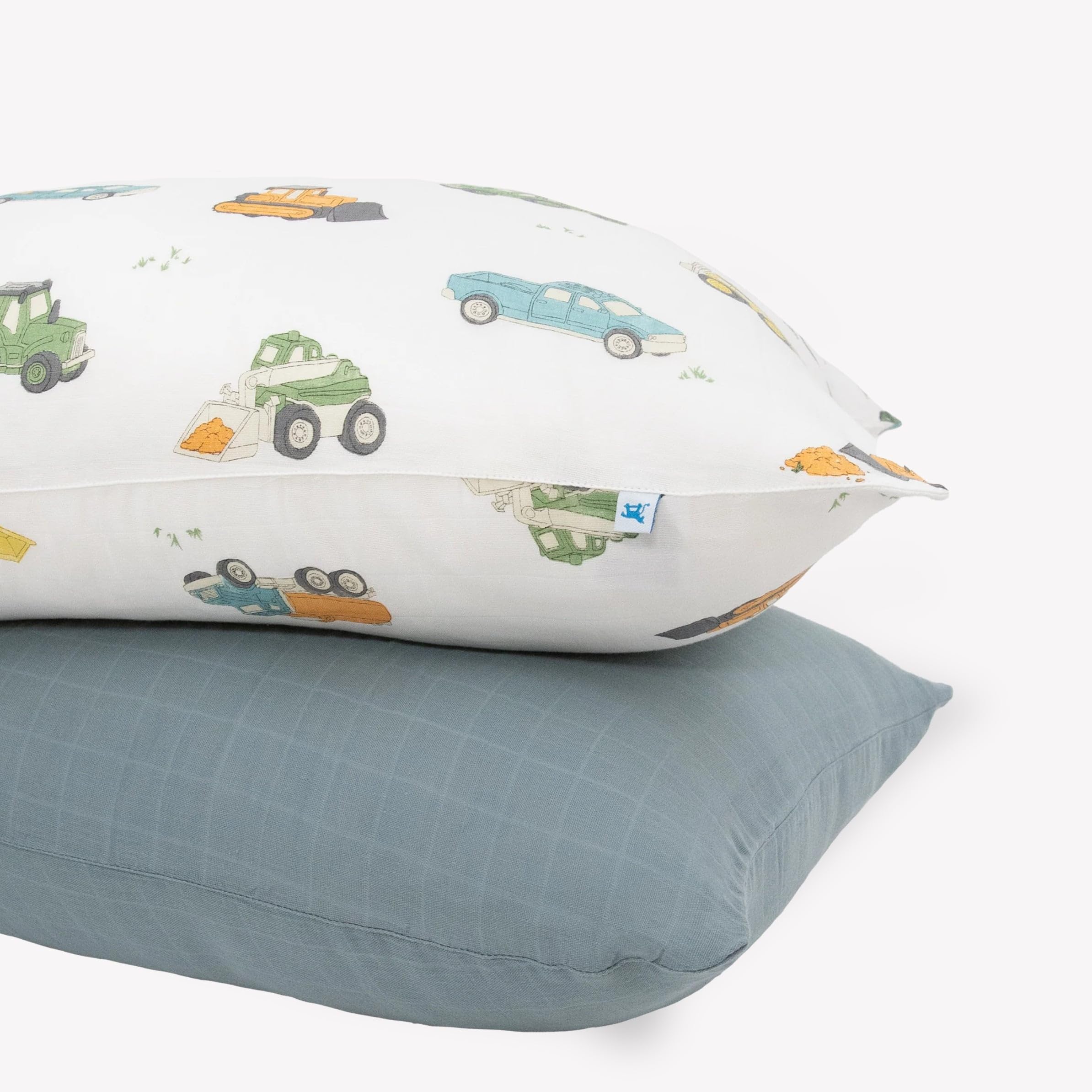 Little Unicorn work trucks pillowcase pack offers cozy muslin softness and secure fit.