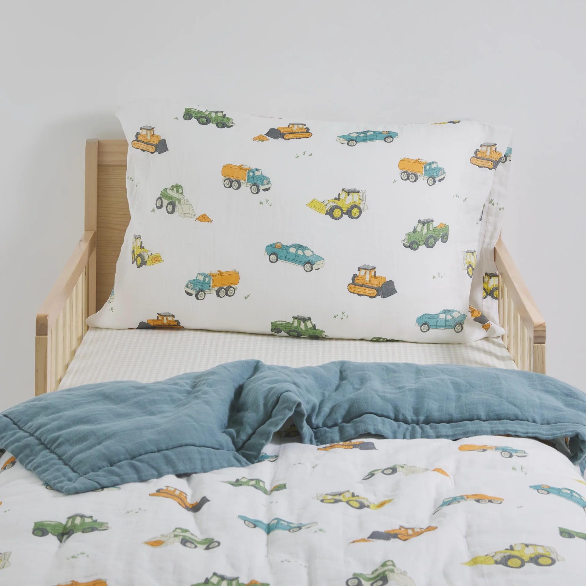 Little Unicorn work-trucks pillowcase features envelope closure keeps pillow in place.