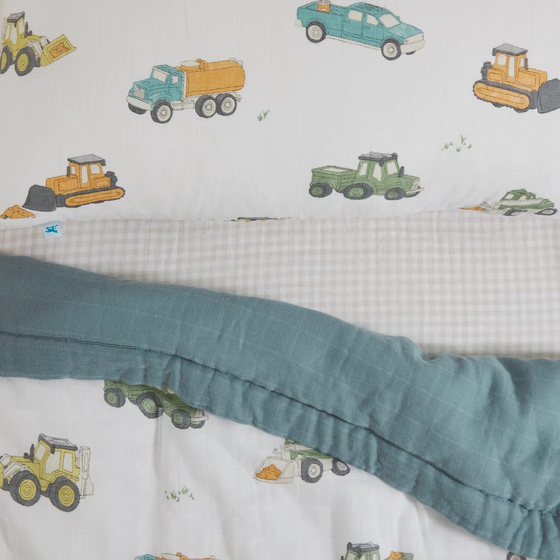 Little Unicorn work-trucks soft-muslin-closeup reveals breathable fabric texture.