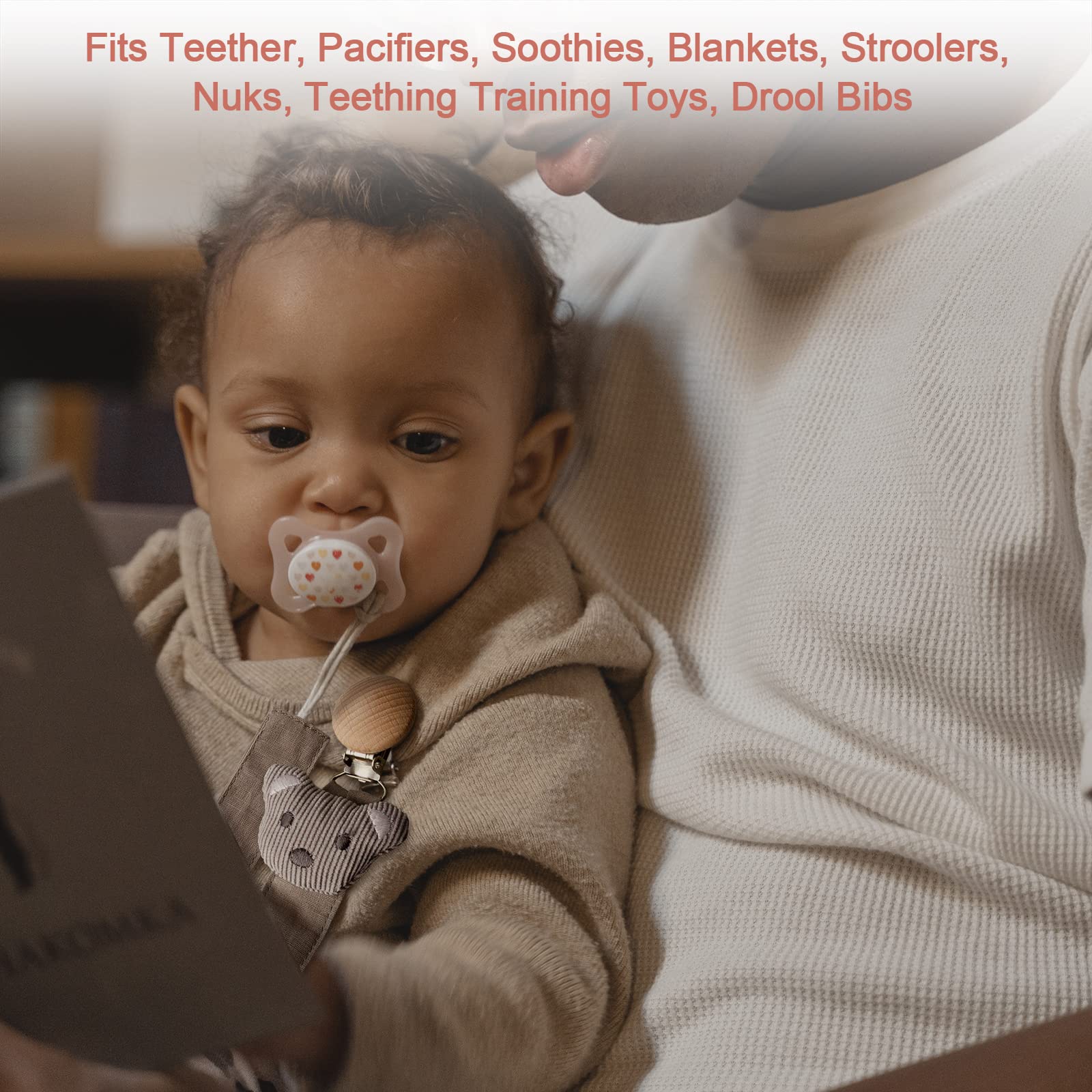 Little World star-pattern clip keeps pacifier within reach during outings.