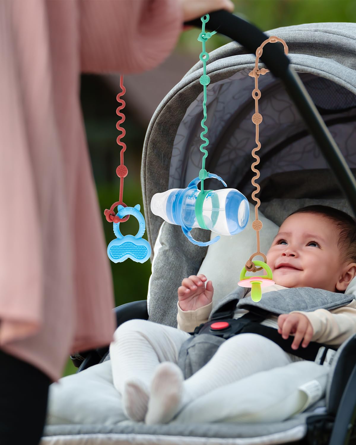 LittleHugs Toy Straps in-use demo shows secure attachment on stroller.