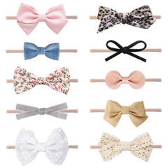LittleJoJo pink sailor bow headband; soft nylon band for gentle newborn comfort and photos.