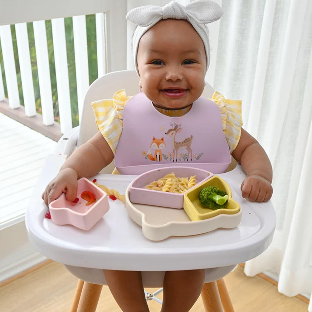 Little Rawr adjustable-closure bib provides secure, comfortable fit.