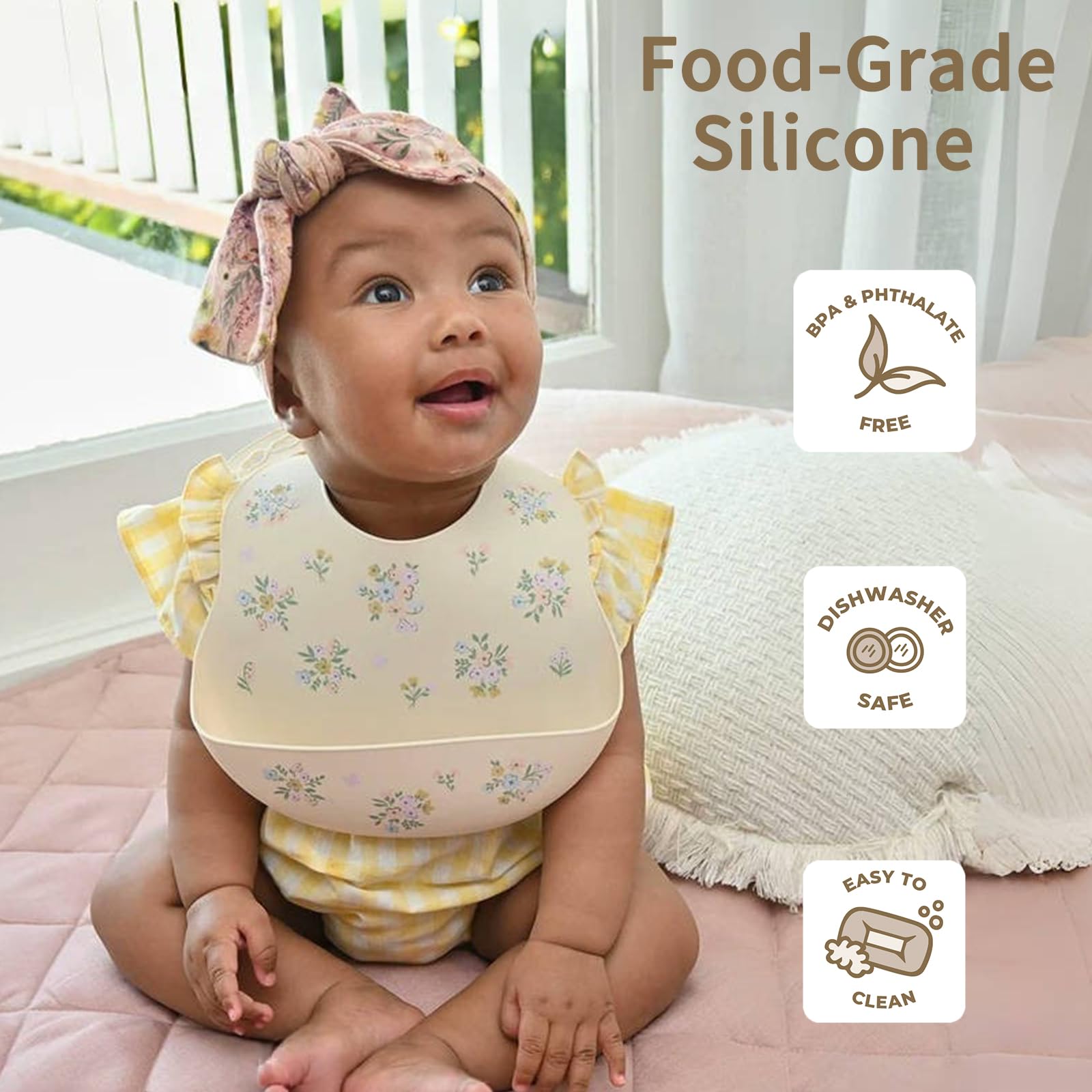 Little Rawr silicone bib with food catcher contains mess during feeding.