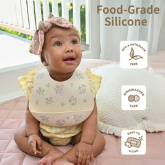Little Rawr silicone bib with food catcher contains mess during feeding.