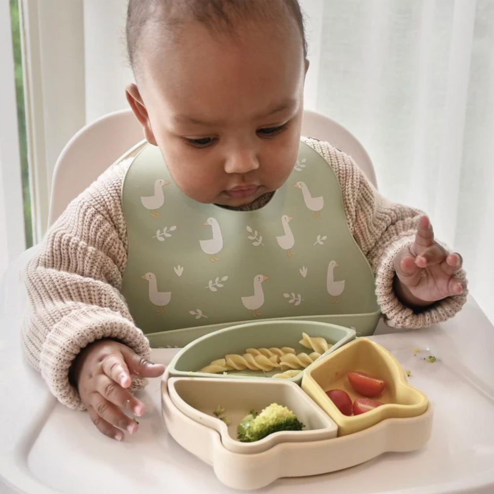 Little Rawr stylish-patterns-colors bibs add cute, modern mealtime look.