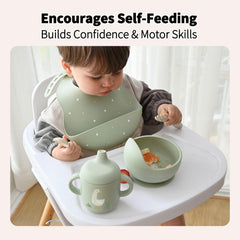 Little Rawr deep-pocket bib captures dropped food for easier cleanup.