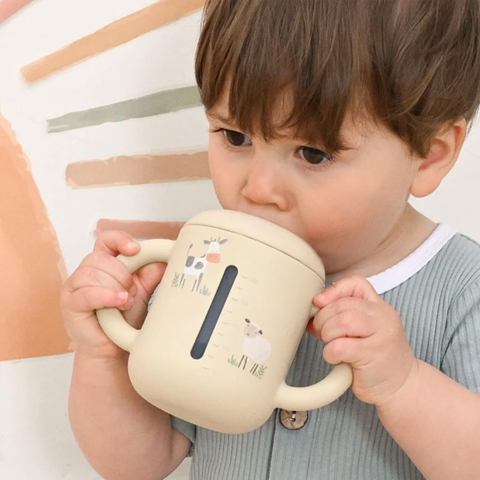 Little Rawr beige leak-proof double-seal sippy cup prevents spills during playtime.