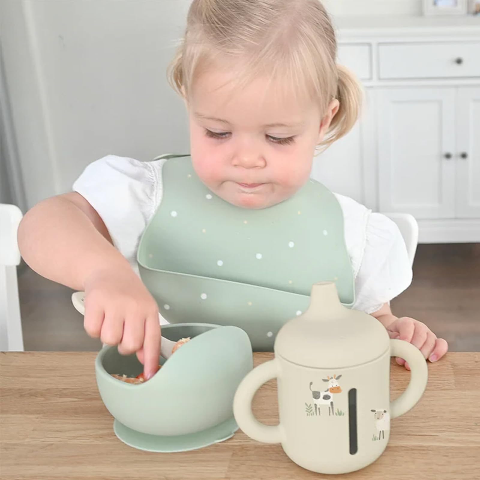 Little Rawr beige two-handles sippy cup provides easy grip for tiny hands.