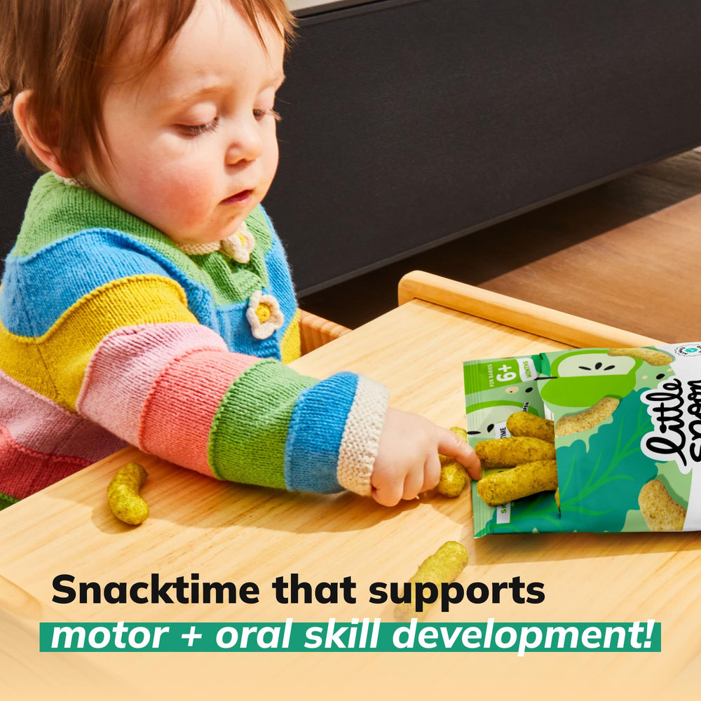 Baby on-the-go snacking scene with easy-open packaging.