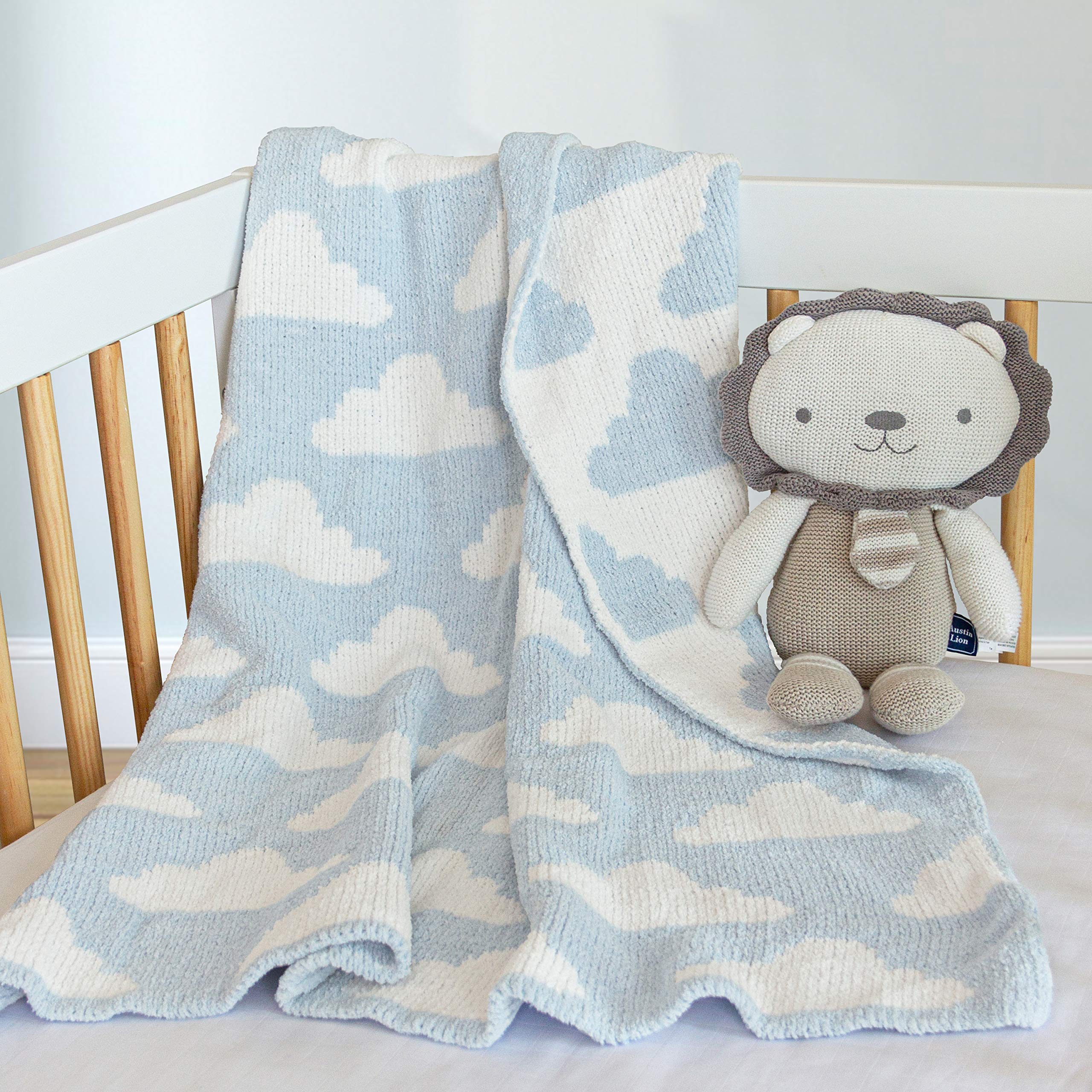 Living Textiles Blue Clouds Chenille blanket used as a swaddle option for newborns.