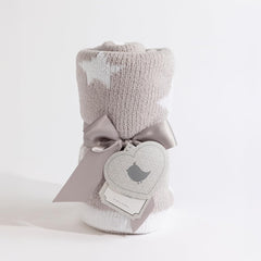 Living Textiles Chenille Blanket Grey Galaxy draped for cozy playtime
