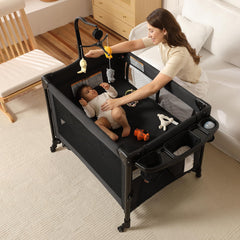 LMOTAU Pack and Play changing table attached for quick diaper changes