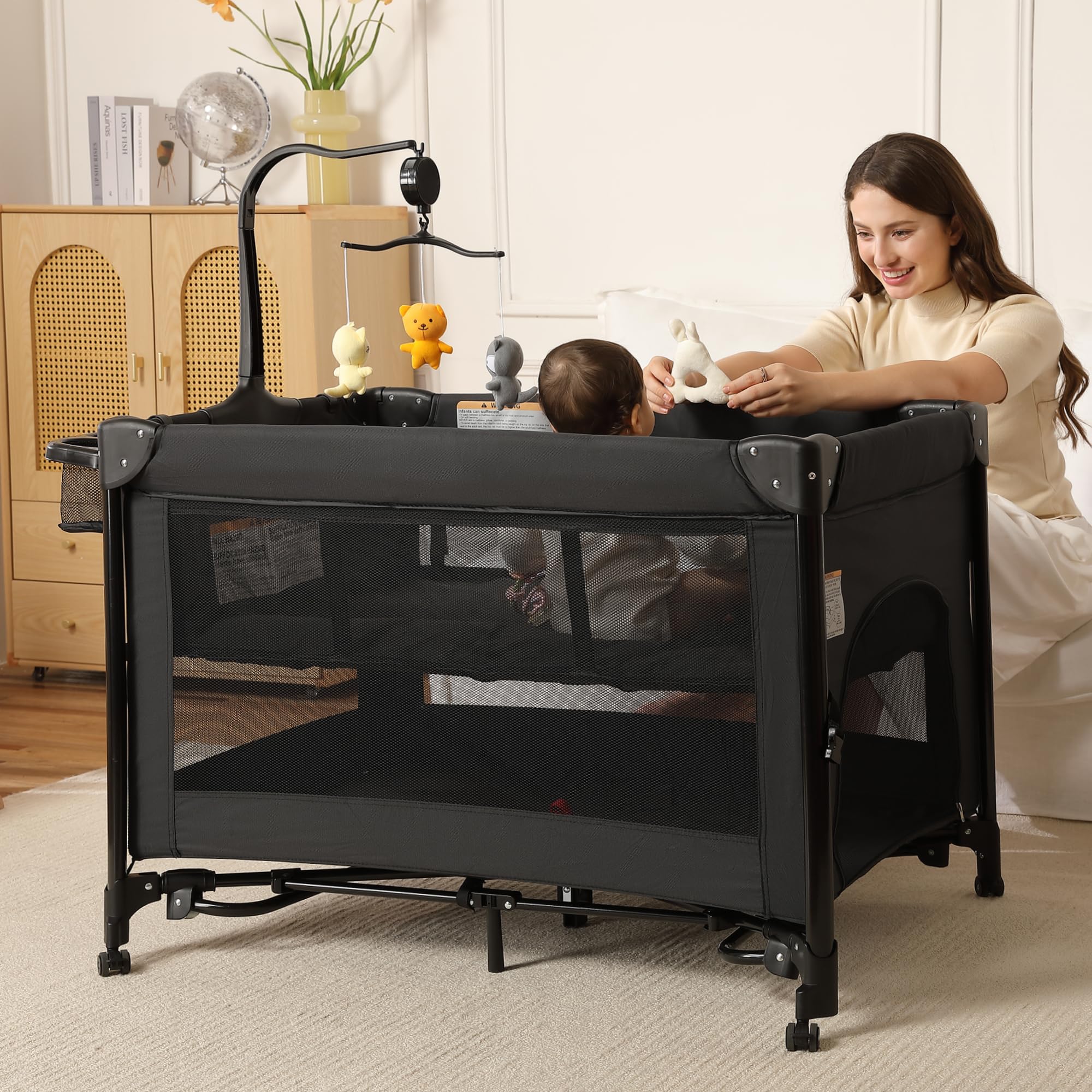 LMOTAU Pack and Play portable crib folded for compact storage and travel