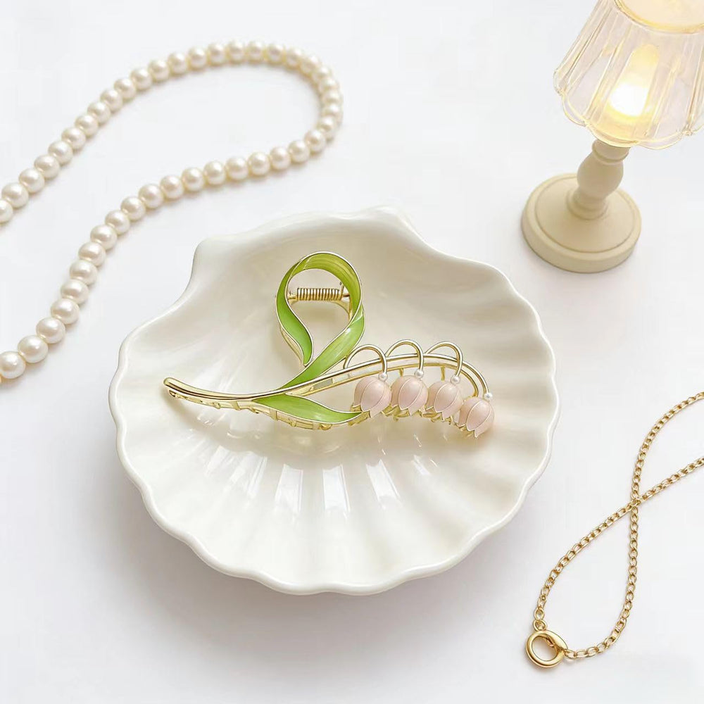 LNYMZD lily-valley flower hair clip showcases botanical charm with secure grip.