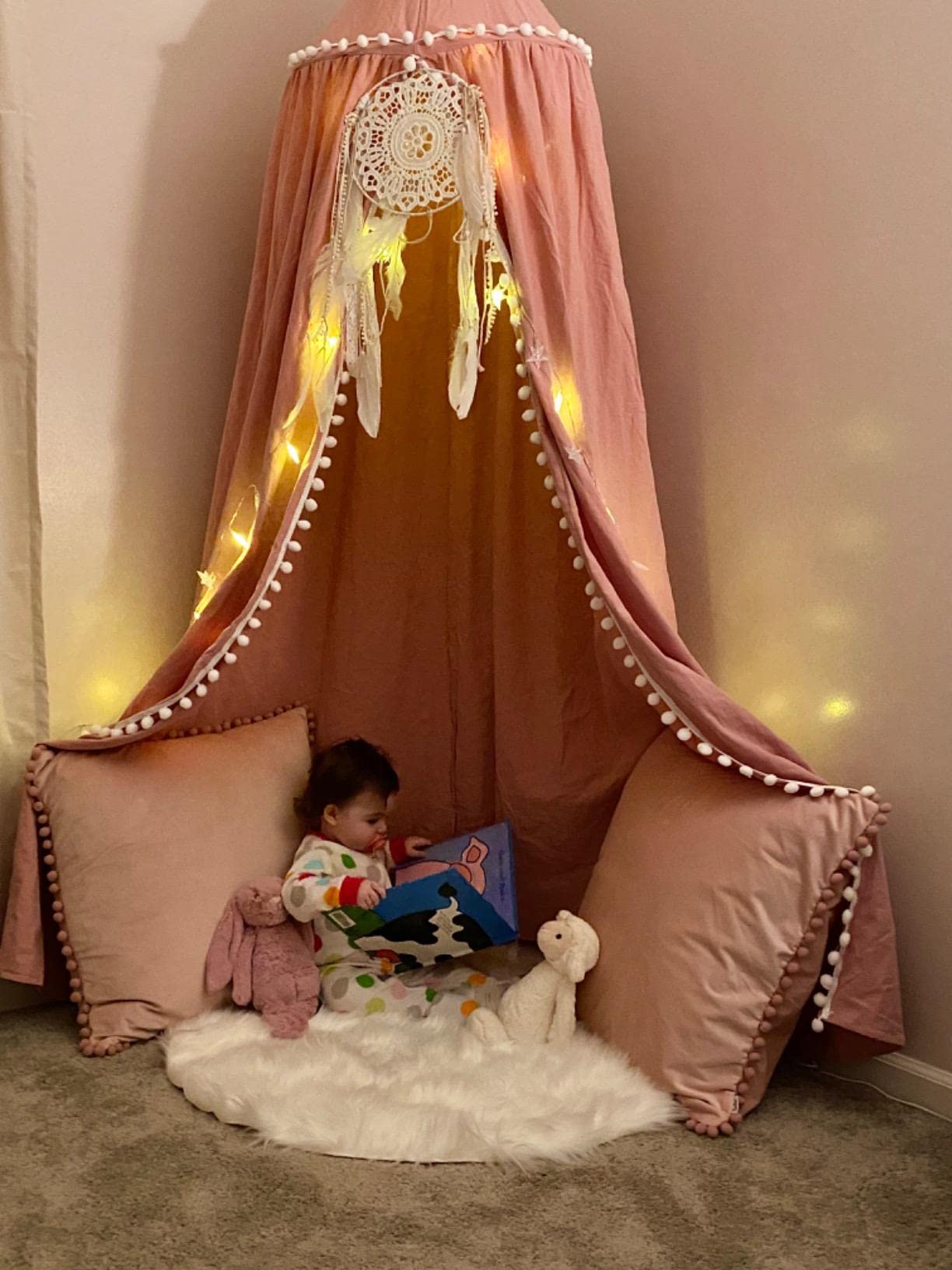 LOAOL bed canopy soft fabric creates a cozy shade for nap time.