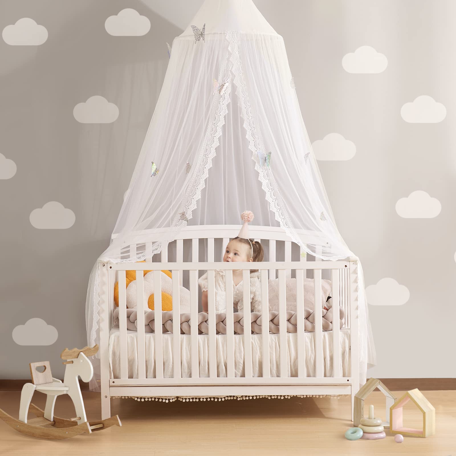 LOAOL Butterfly bed canopy over crib creates a cozy, fairy-tale sleep space.