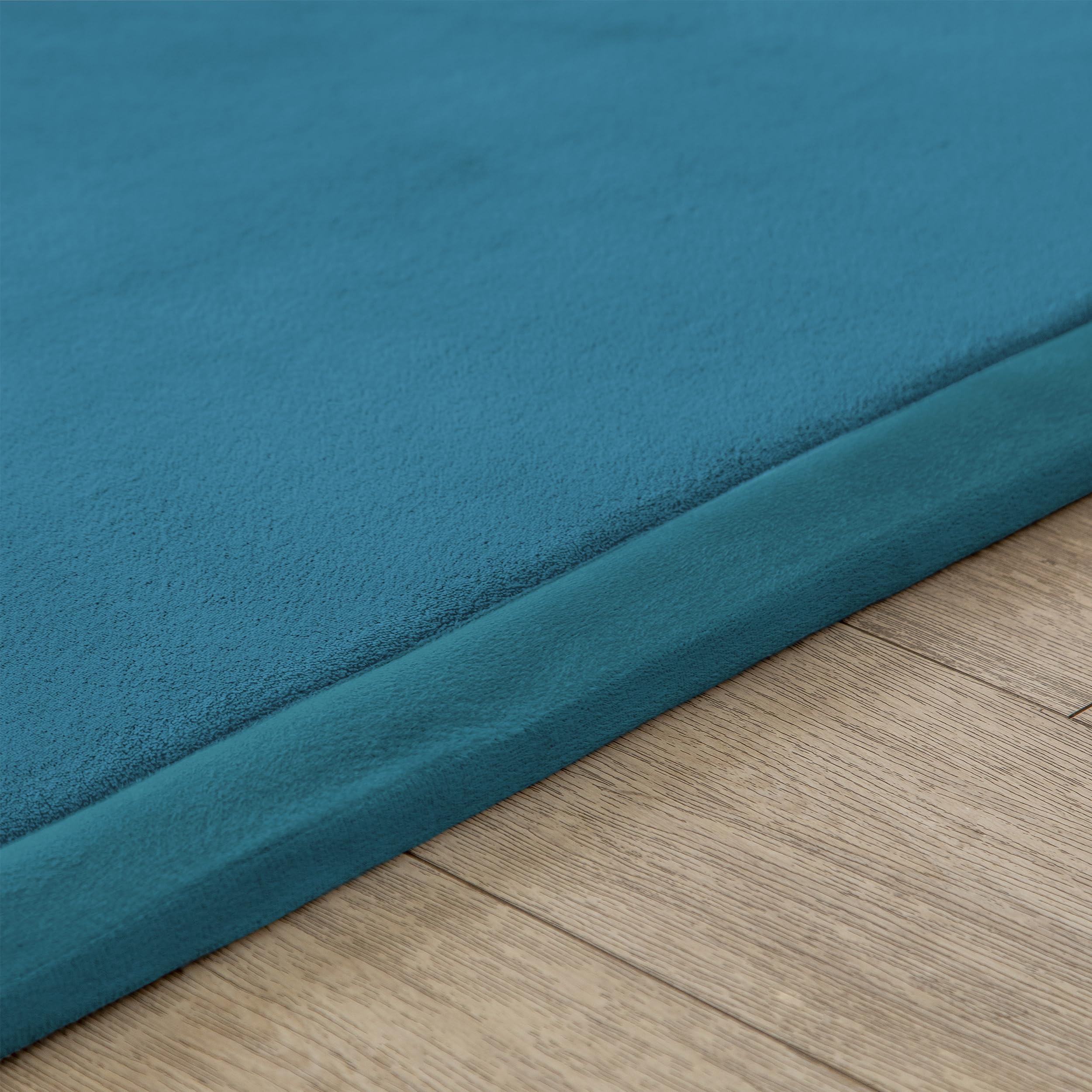 Loartee Coral Velvet Crawling Rug blue noise-dampening mat supports calmer sessions.