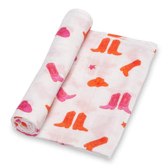 LollyBanks baby muslin swaddle blanket soft pink boot print for cozy newborn cuddles.